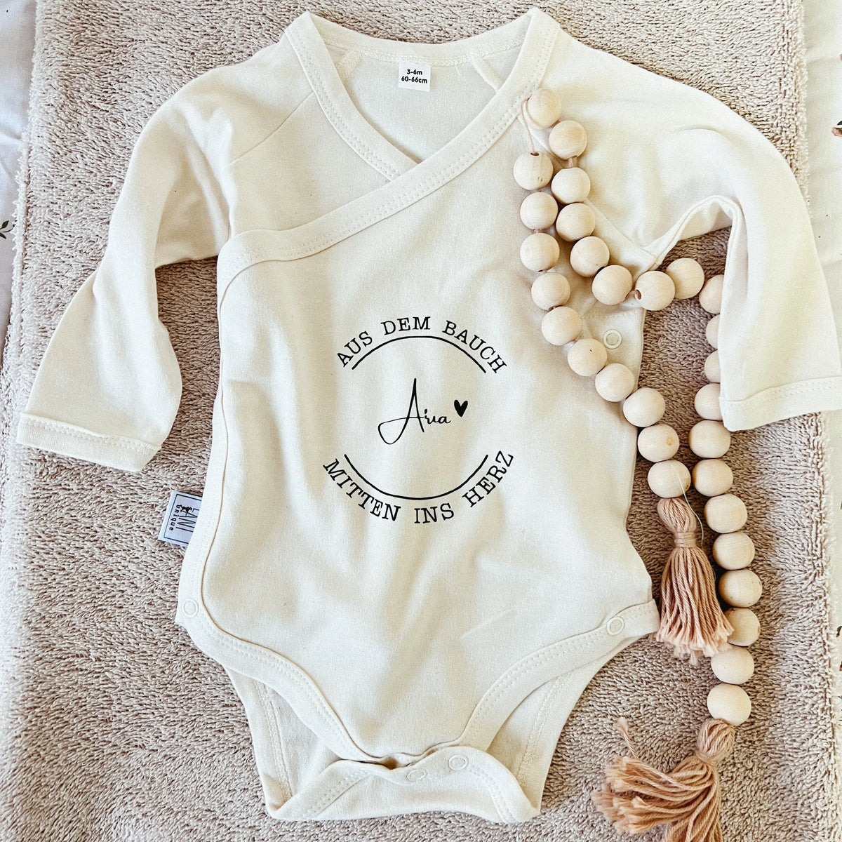 Babybody "mitten ins Herz" aus Biobaumwolle mit Wunschnamen